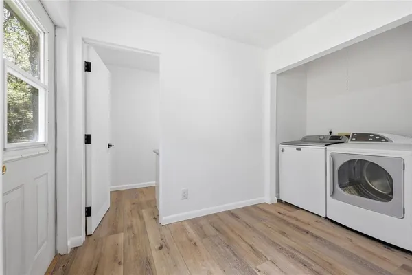 a view of a storage & utility room with washer and dryer