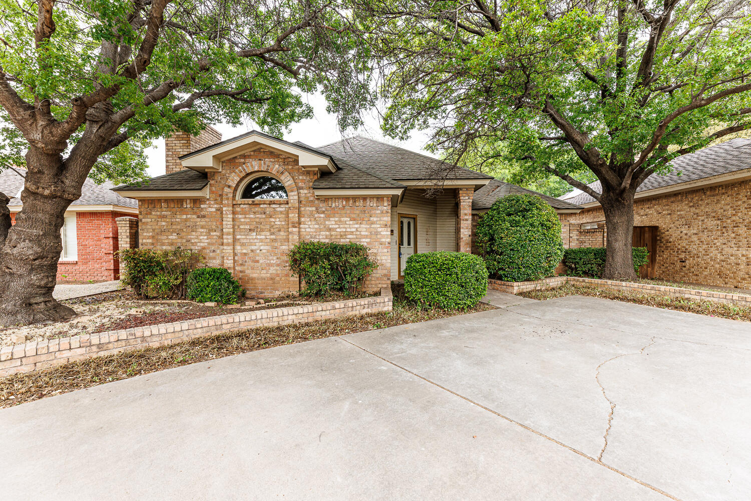 7610 Utica Avenue Lubbock, TX 79424 - Photo 1 of 49 front view of a house with a yard