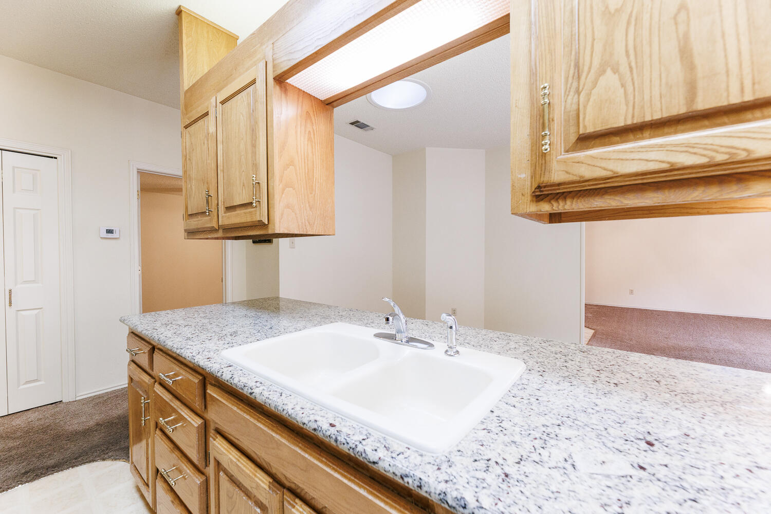 7610 Utica Avenue Lubbock, TX 79424 - Photo 20 of 49 a bathroom with a sink and a mirror