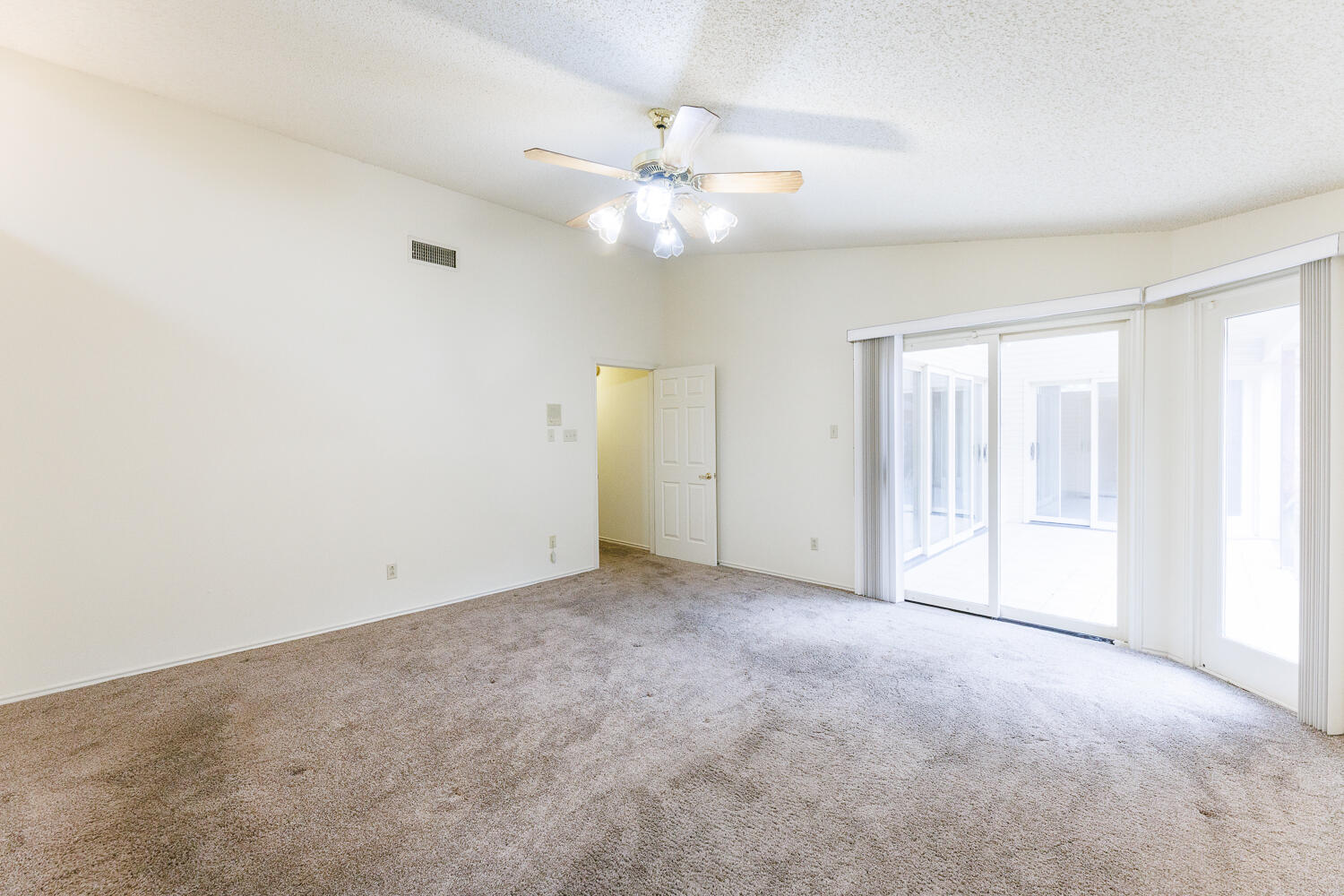 7610 Utica Avenue Lubbock, TX 79424 - Photo 25 of 49 an empty room with fan and windows