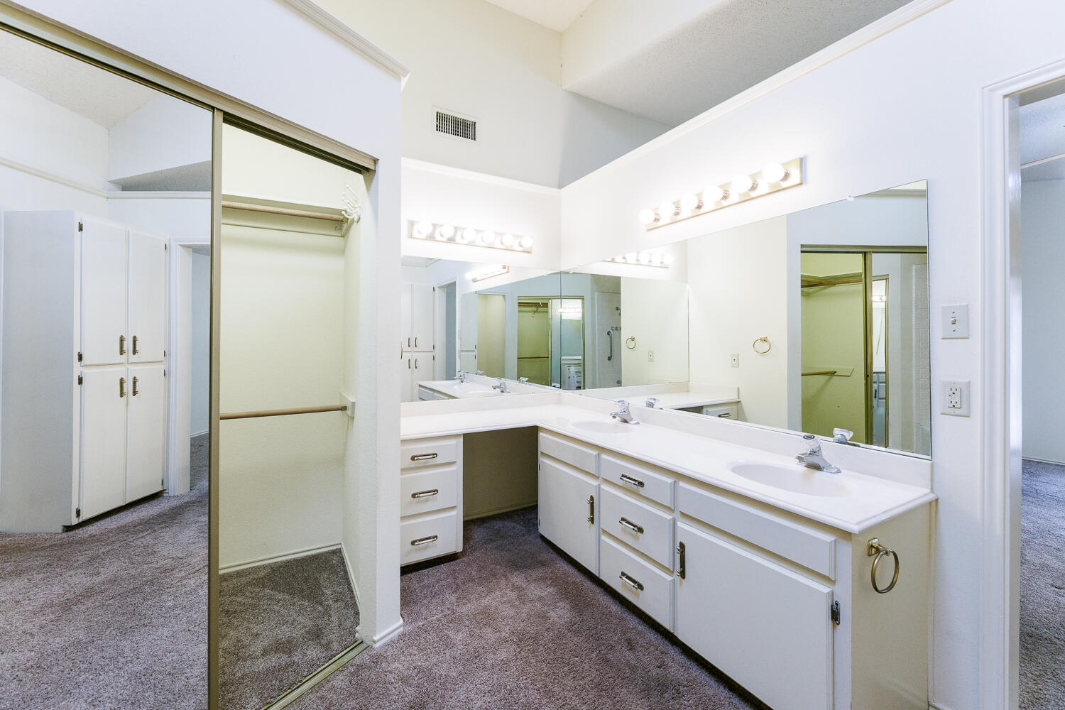 7610 Utica Avenue Lubbock, TX 79424 - Photo 28 of 49 a spacious bathroom with a double vanity sink mirror and double