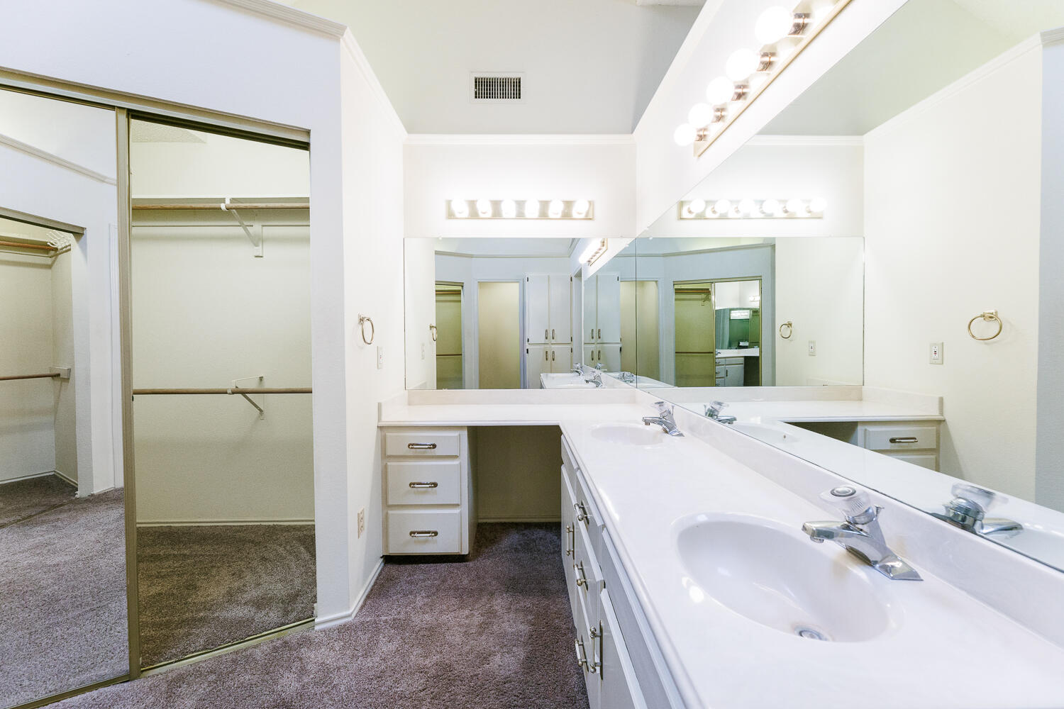 7610 Utica Avenue Lubbock, TX 79424 - Photo 30 of 49 a bathroom with a sink and a mirror