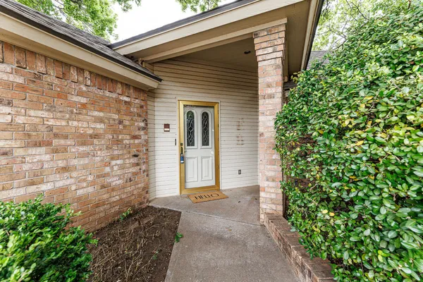 a front view of a house with a garage