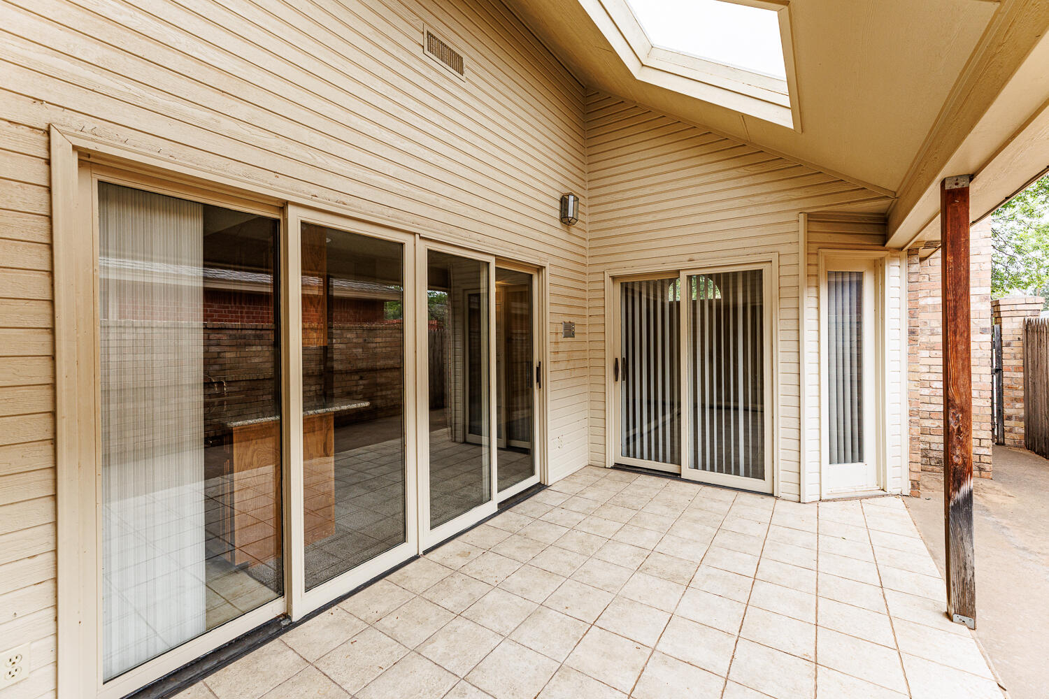 7610 Utica Avenue Lubbock, TX 79424 - Photo 42 of 49 a view of a brick house with a large window
