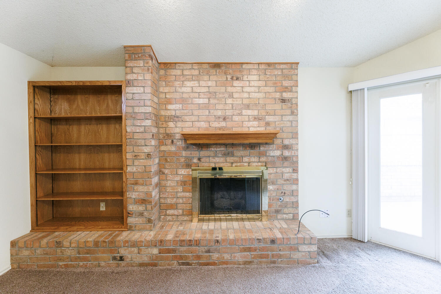 7610 Utica Avenue Lubbock, TX 79424 - Photo 8 of 49 a living room with a fireplace