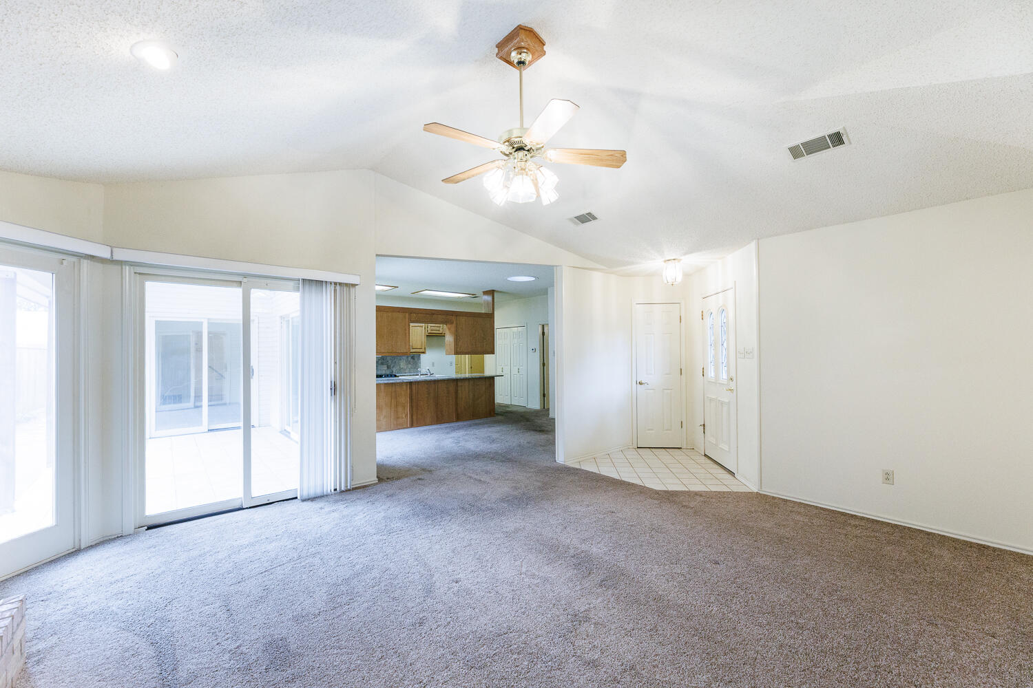 7610 Utica Avenue Lubbock, TX 79424 - Photo 10 of 49 a view of an empty room with a window