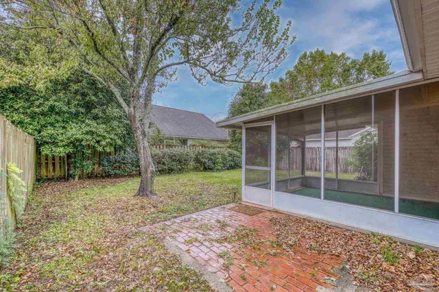 a backyard of a house with lots of green space