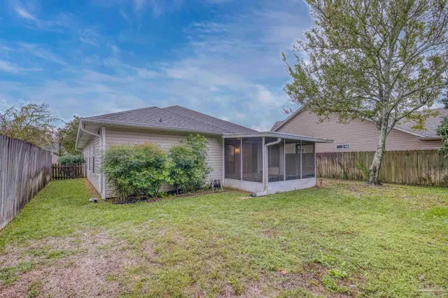 a view of a house with a yard and plants