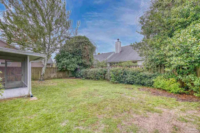 a backyard of a house with lots of green space