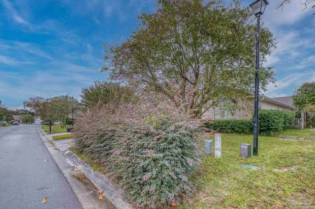 a view of a lake with a house in the background