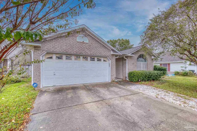 a view of a house with a street