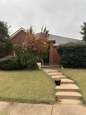 a view of a house with pool and plants