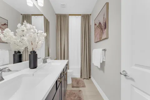 a bedroom with double bed and a window