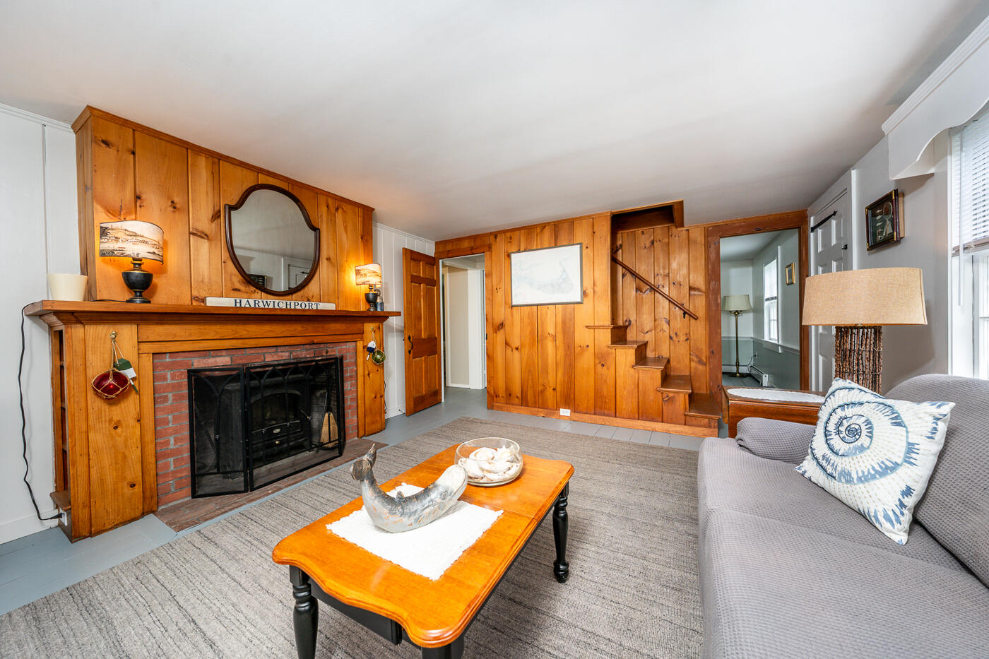 264 Route 28 Harwich, MA 02646 - Photo 13 of 39 a living room with furniture and a fireplace