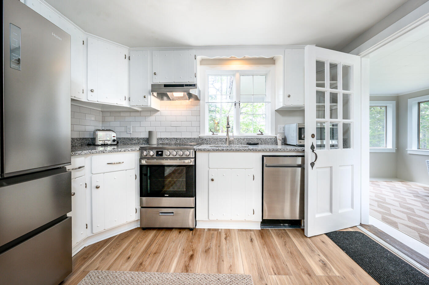 264 Route 28 Harwich, MA 02646 - Photo 16 of 39 a kitchen with a white cabinets stove and sink
