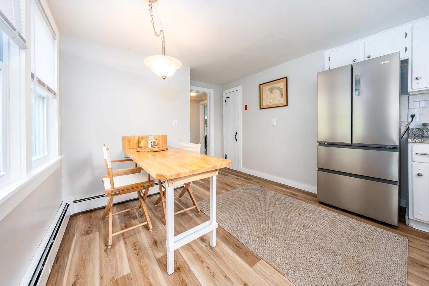 264 Route 28 Harwich, MA 02646 - Photo 17 of 39 a view of a dining room with furniture and a refrigerator