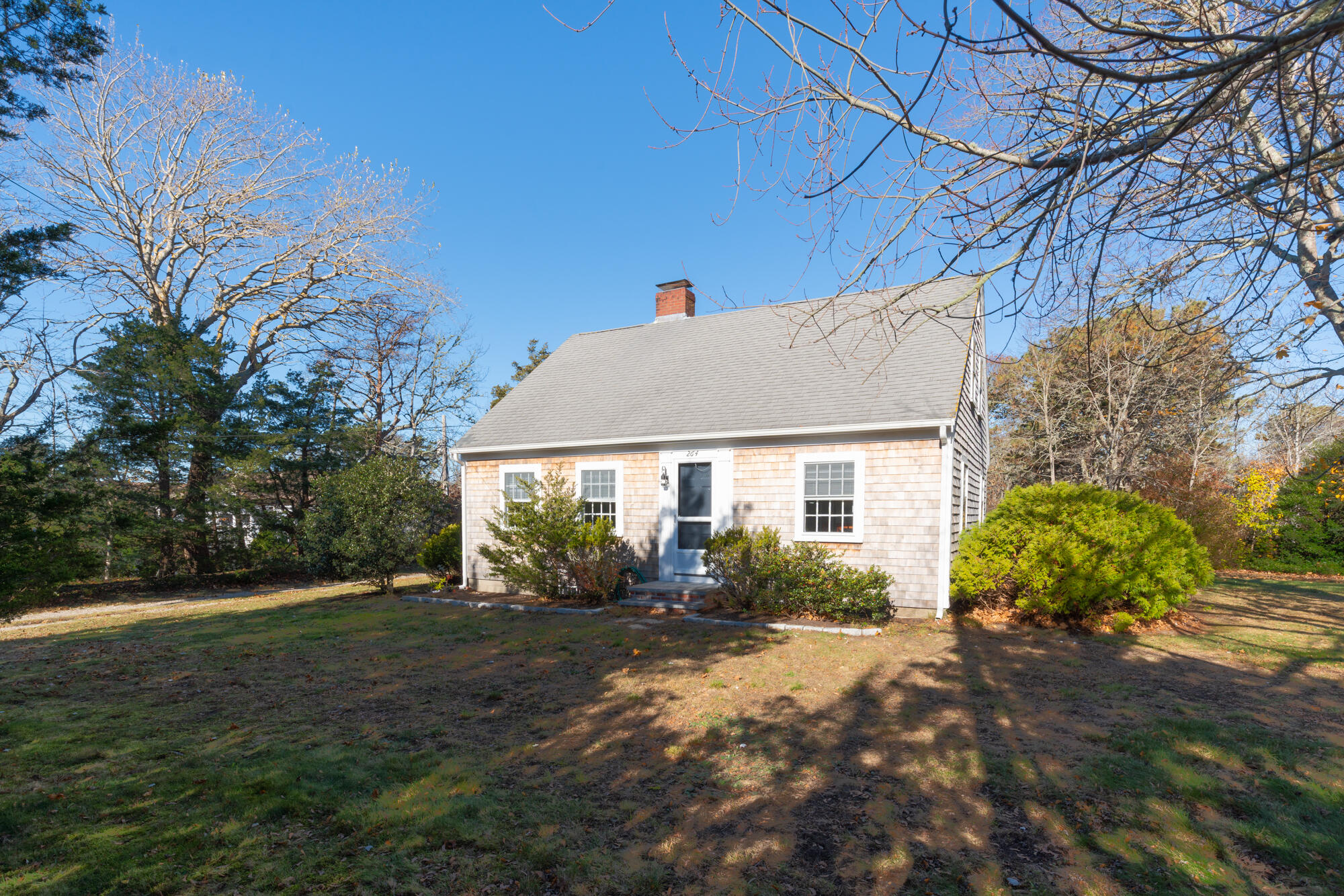 264 Route 28 Harwich, MA 02646 - Photo 2 of 39 a view of a house with backyard and garden