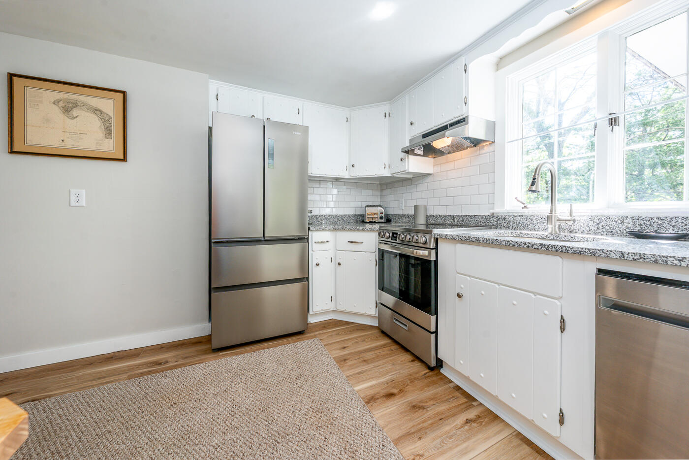 264 Route 28 Harwich, MA 02646 - Photo 21 of 39 a kitchen with a stove a sink and a refrigerator