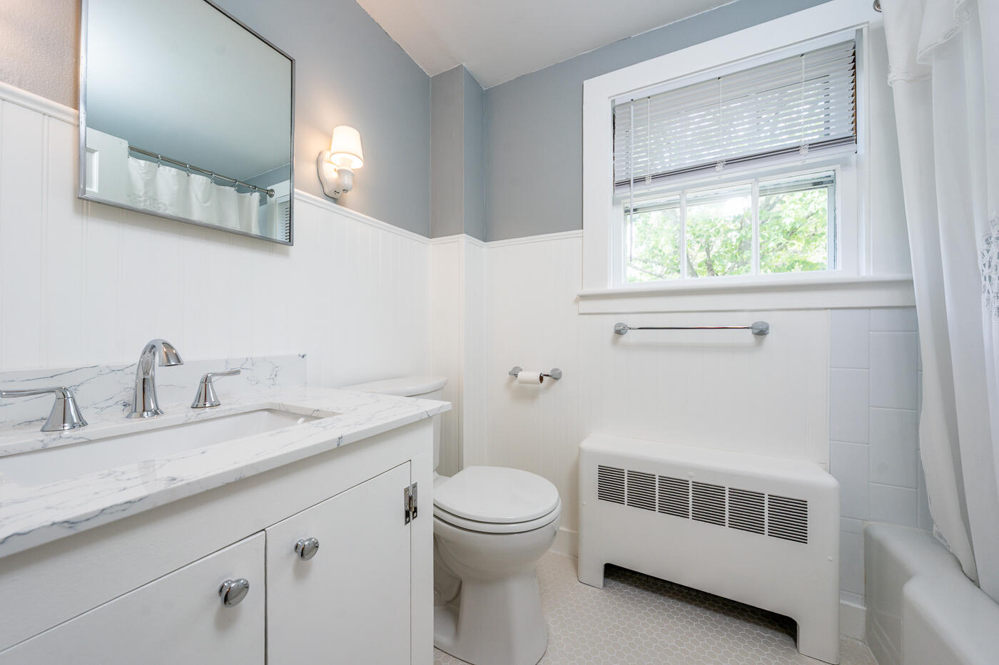 264 Route 28 Harwich, MA 02646 - Photo 25 of 39 a bathroom with a granite countertop sink a toilet and a mirror