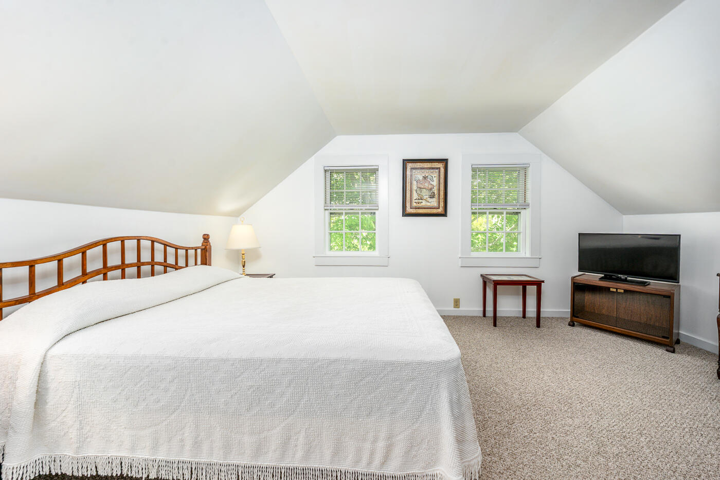 264 Route 28 Harwich, MA 02646 - Photo 28 of 39 a bedroom with a bed and a couch
