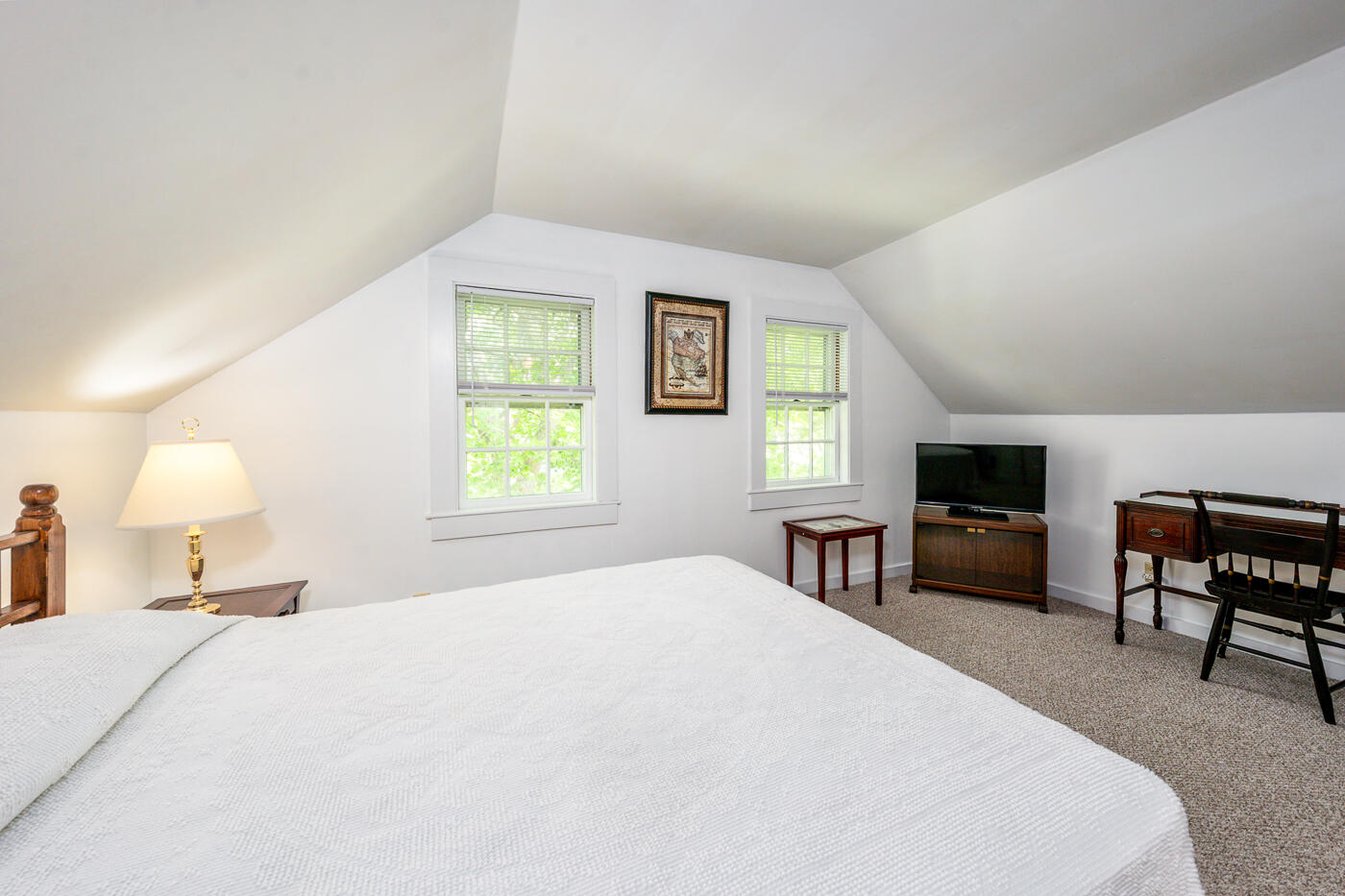 264 Route 28 Harwich, MA 02646 - Photo 29 of 39 a bedroom with a bed and a tv on table