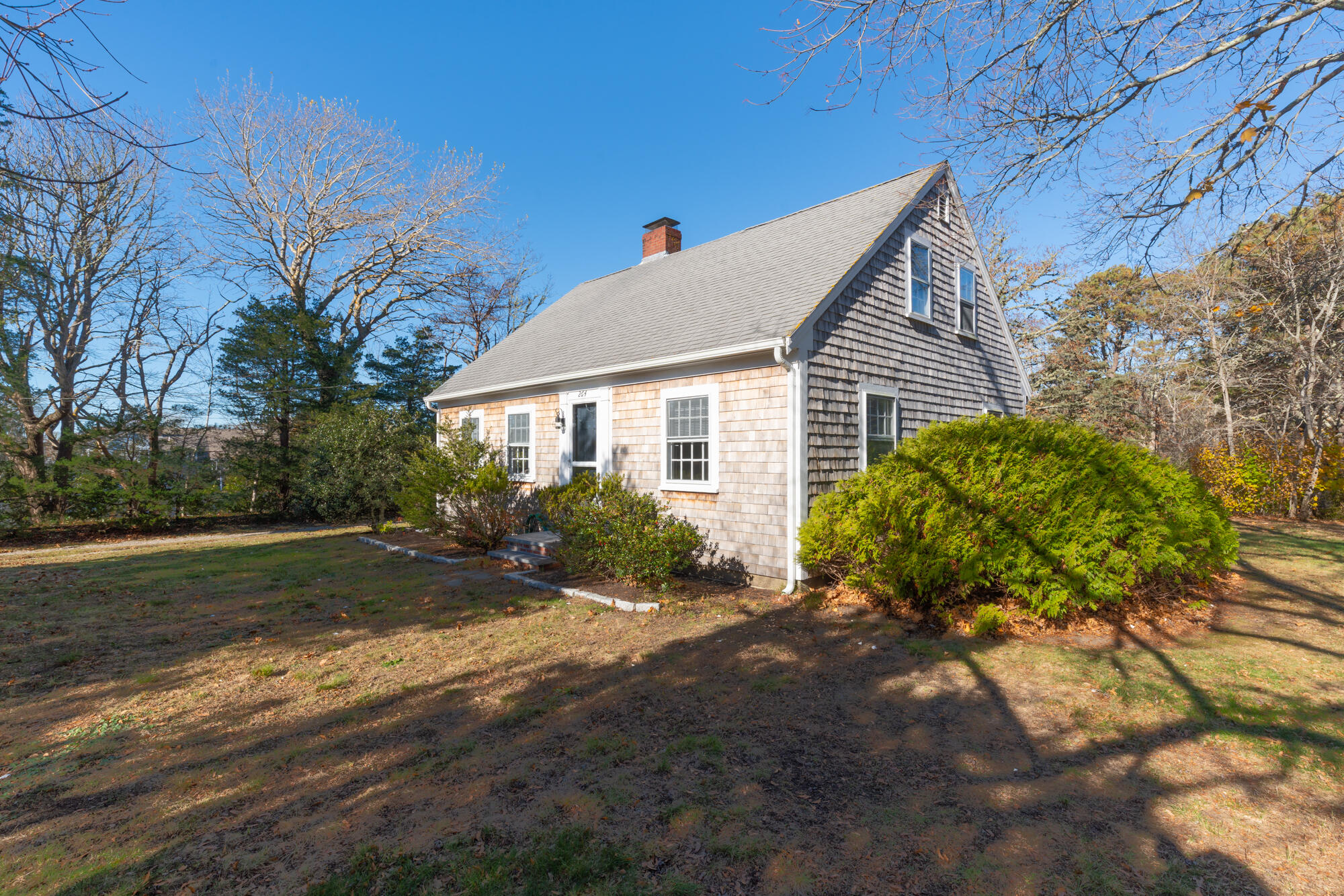 264 Route 28 Harwich, MA 02646 - Photo 3 of 39 a front view of a house with garden