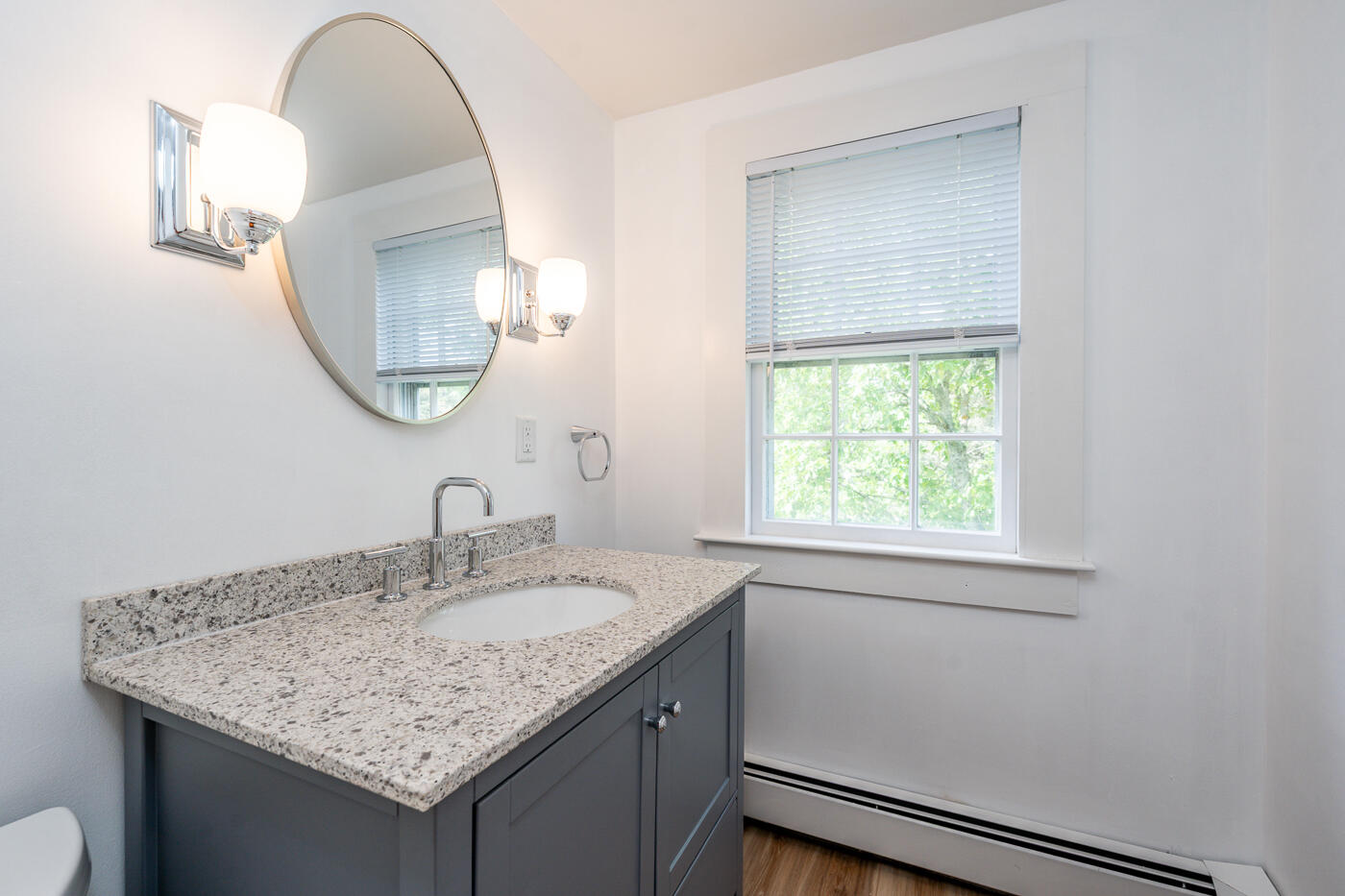 264 Route 28 Harwich, MA 02646 - Photo 31 of 39 a bathroom with a granite countertop sink a mirror and a window