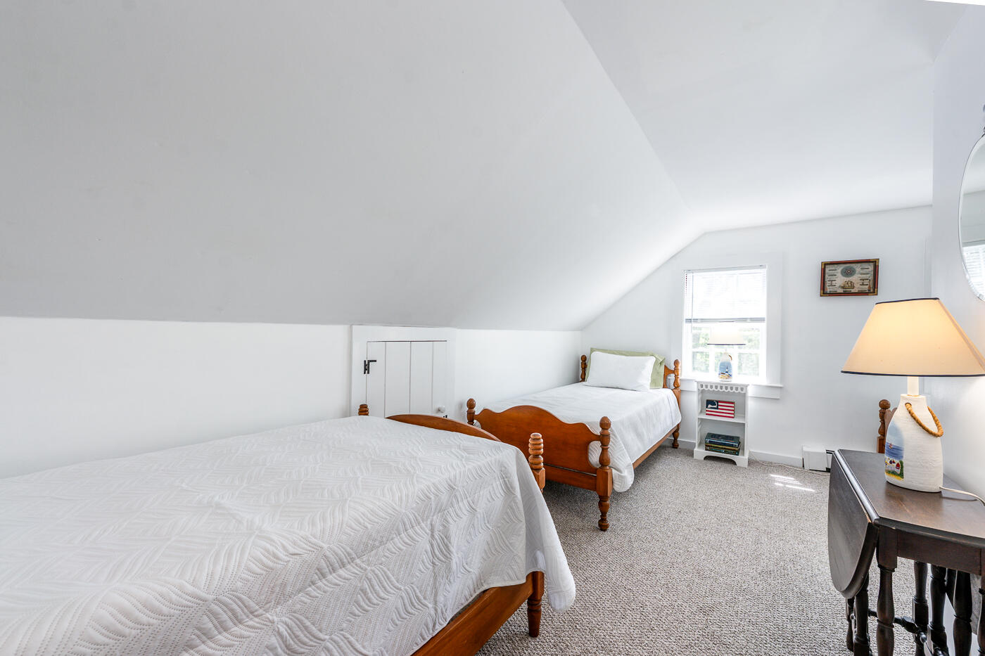 264 Route 28 Harwich, MA 02646 - Photo 32 of 39 a bed room with two bed and a lamp