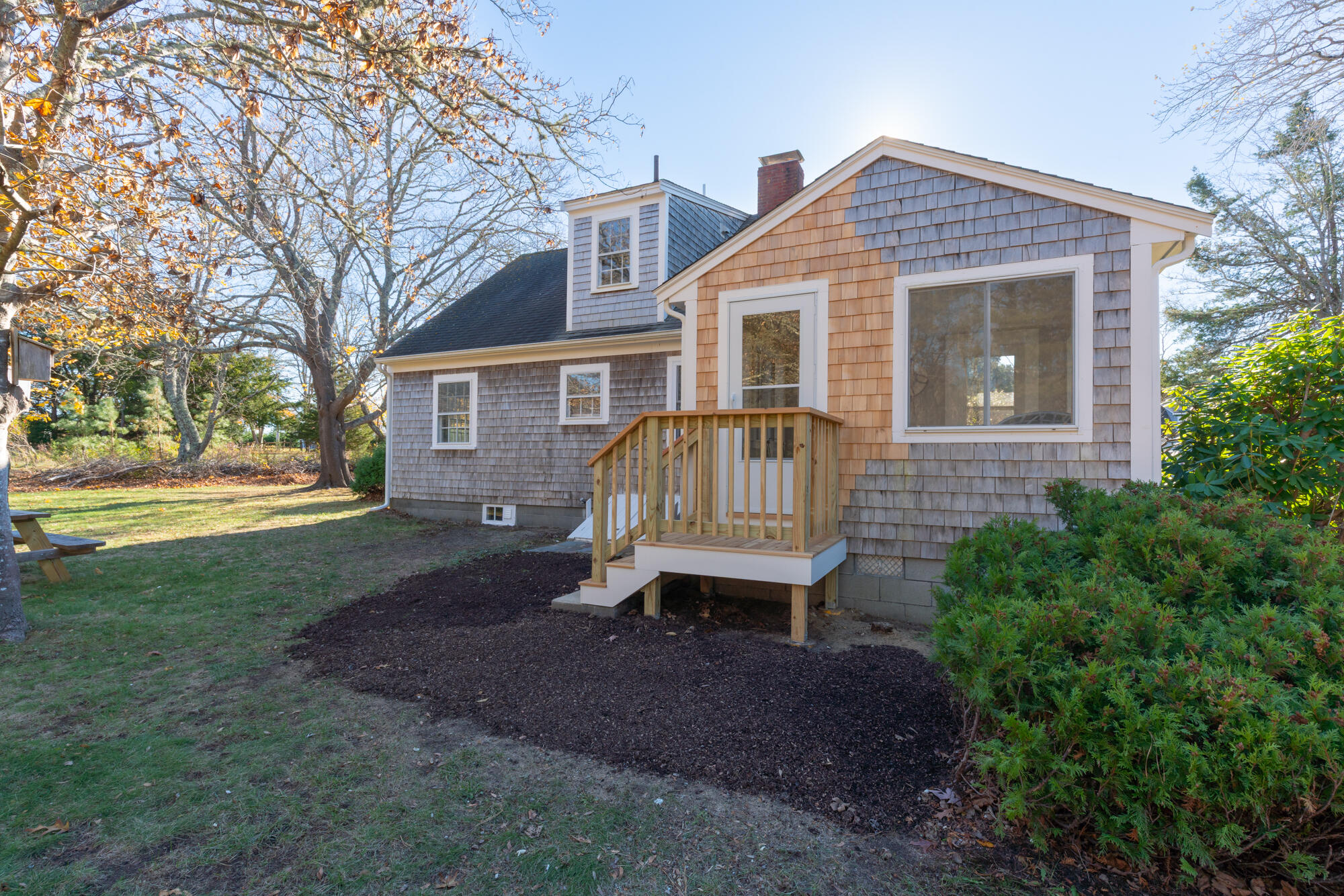 264 Route 28 Harwich, MA 02646 - Photo 7 of 39 a front view of a house with garden and porch