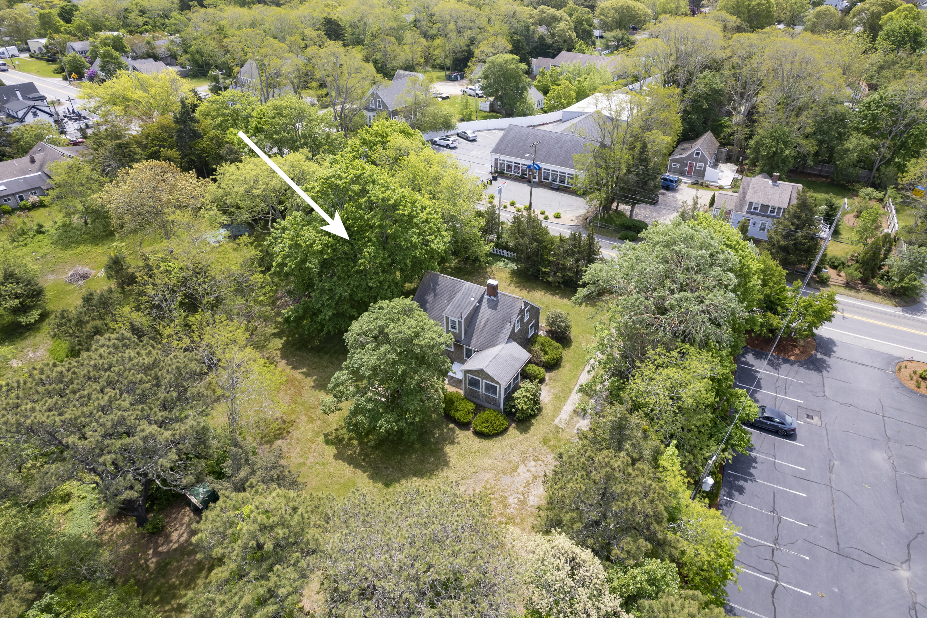 264 Route 28 Harwich, MA 02646 - Photo 9 of 39 an aerial view of residential houses with outdoor space and trees
