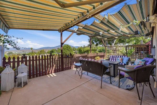 a view of a chairs and table in a patio
