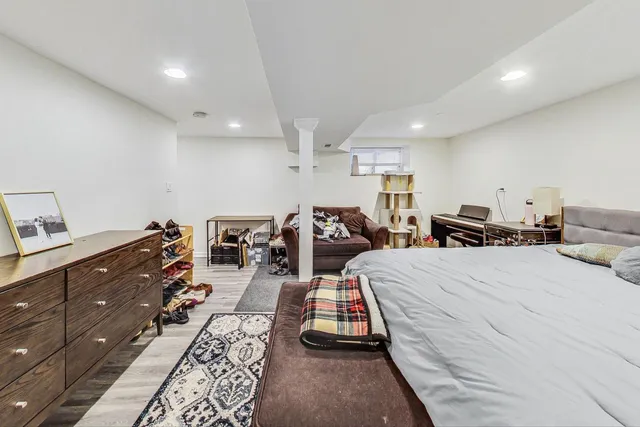 a bed room with large bed and furniture