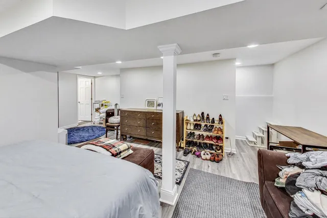 a bed room with a bed and a television