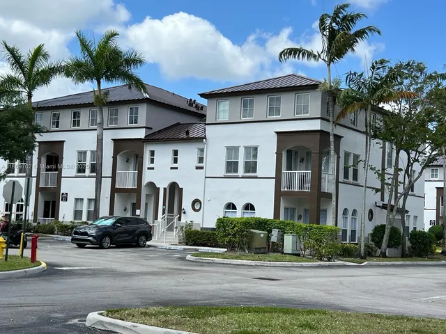 a front view of a building with garden