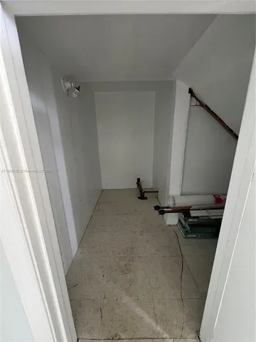 a view of a storage and utility room with a sink