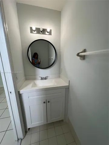 a white toilet sitting next to a white sink