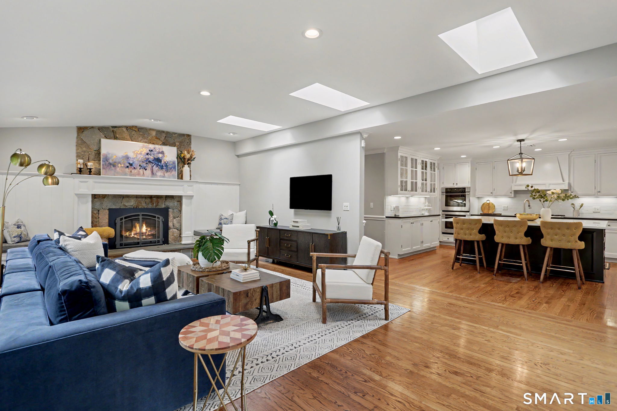 596 Silvermine Road New Canaan, CT 06840 - Photo 7 of 37 Family Room with walls of windows and skylights providing an abundance of natural light