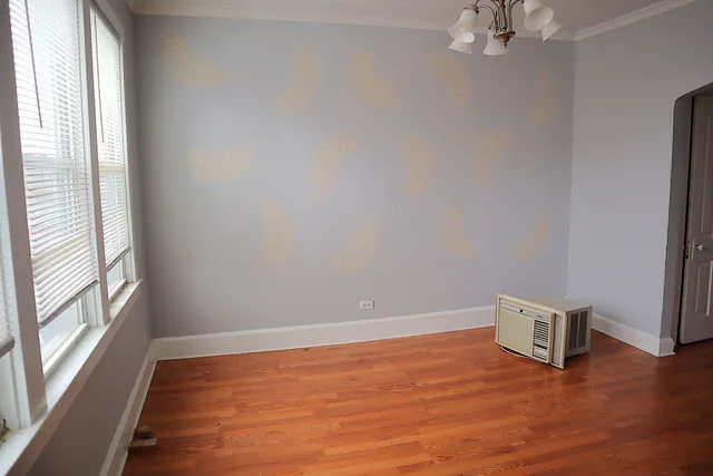 a view of kitchen and hall with wooden floor