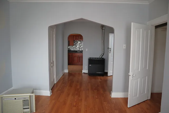 a kitchen with stainless steel appliances granite countertop a stove and a microwave