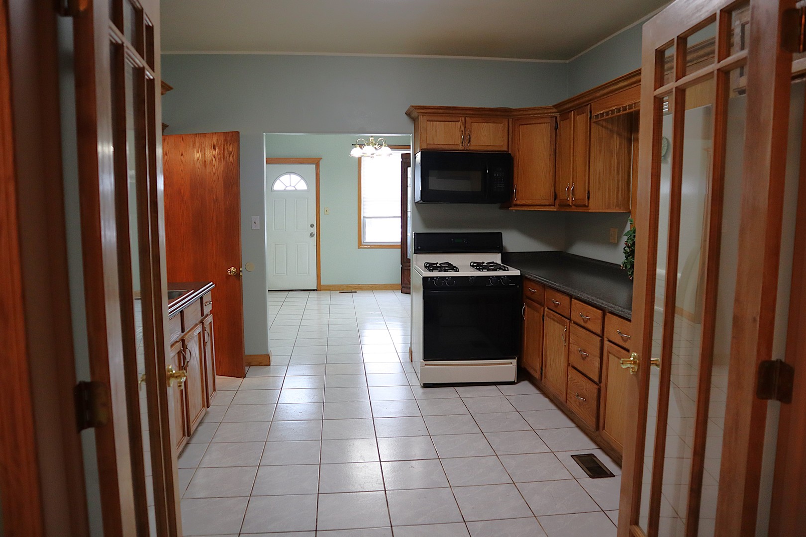 1934 West 21st Place Chicago, IL 60608 - Photo 2 of 25 a kitchen with stainless steel appliances granite countertop a refrigerator and a sink