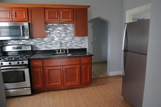 a kitchen with a sink and a microwave