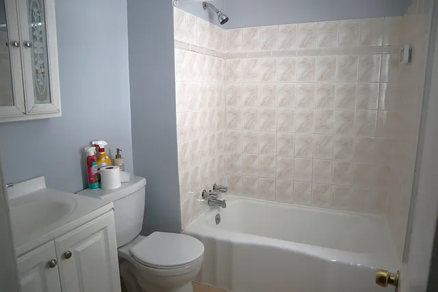 a view of a house with pool and sitting area