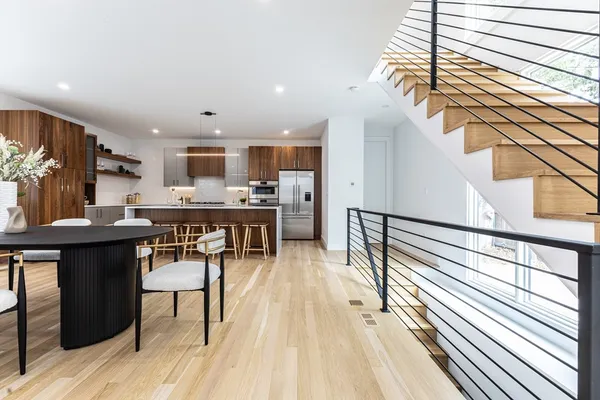 a open kitchen with stainless steel appliances kitchen island granite countertop a sink and cabinets