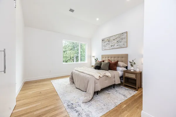 a bed room with a bed and a window
