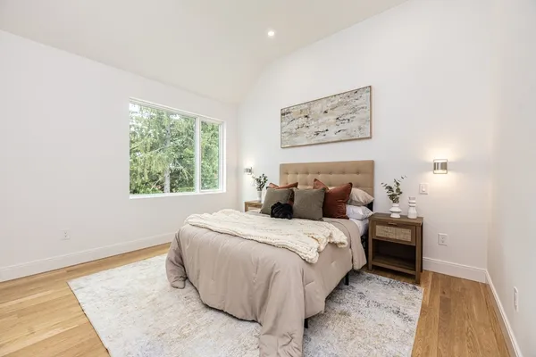 a bedroom with bed and a window