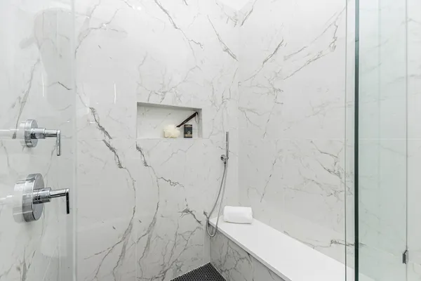a bathroom with a bathtub and shower