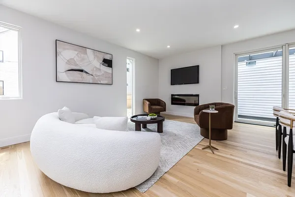 a living room with furniture or couch and a flat screen tv
