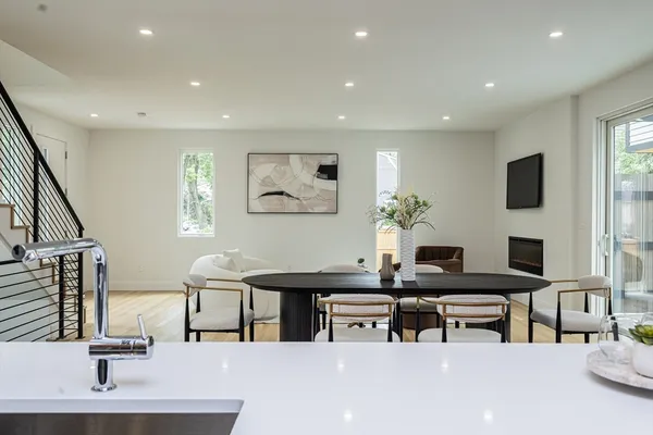 a living room with fireplace furniture and a flat screen tv