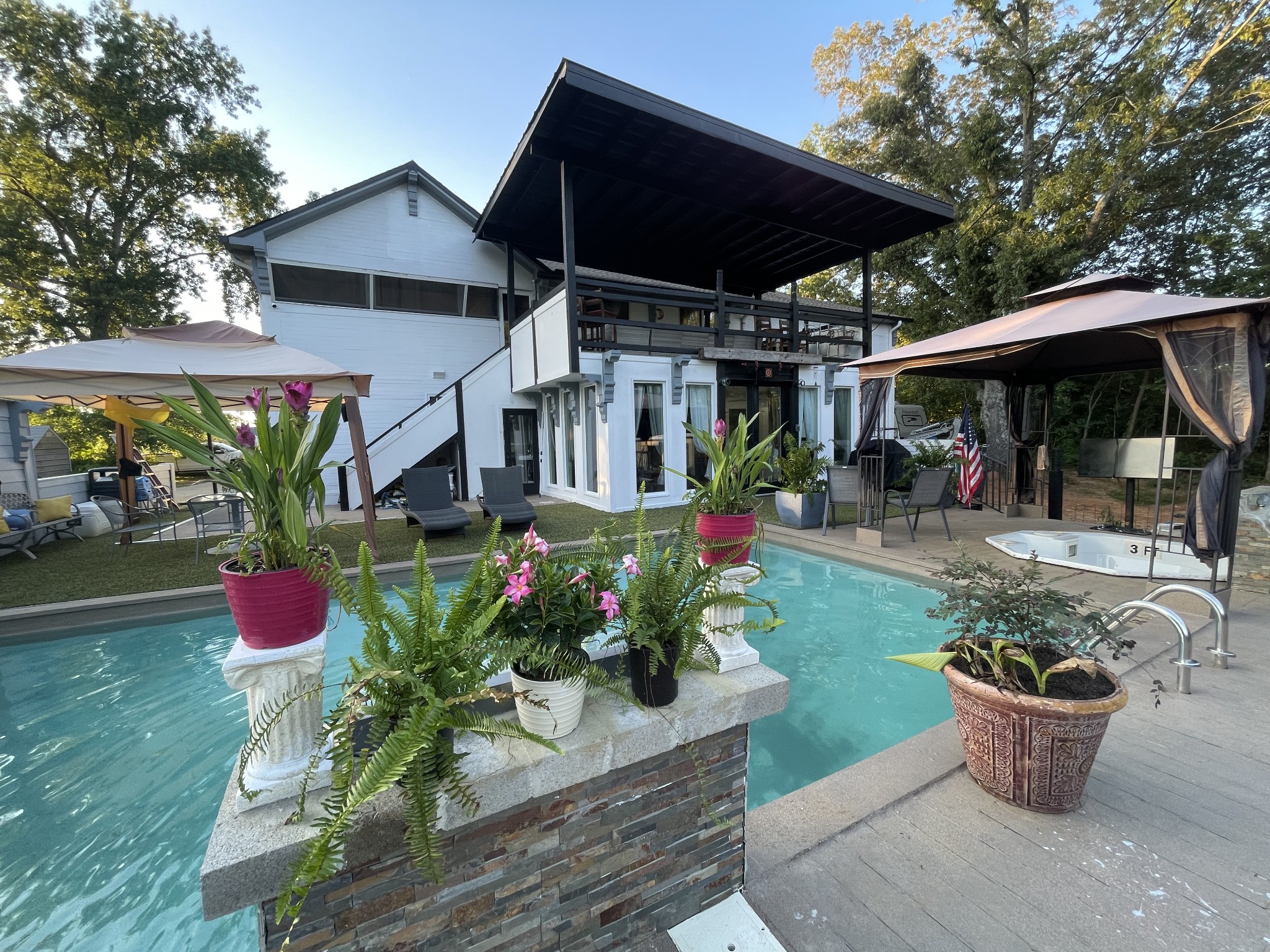 1150 Lafayette Road Clarksville, TN 37042 - Photo 11 of 24 a view of a patio with table and chairs potted plants