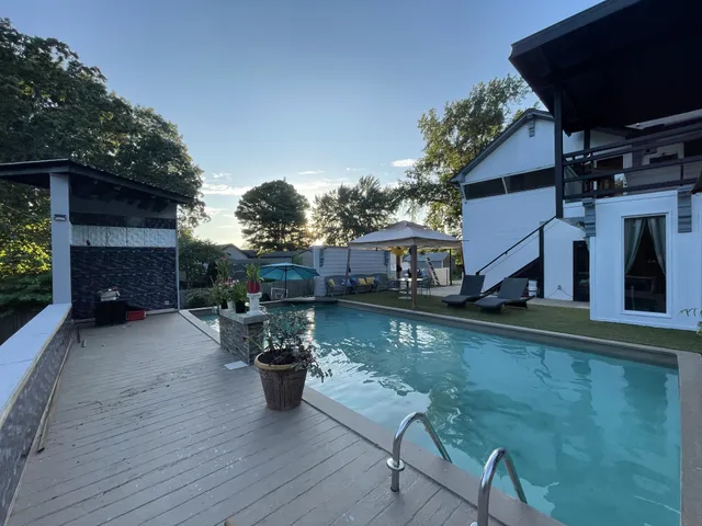 a view of a swimming pool with a patio